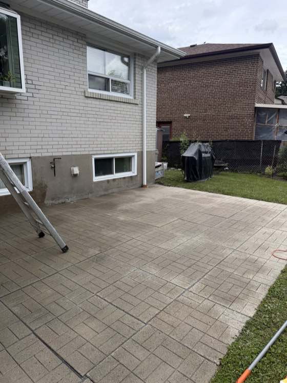 Paver patio being prepped for new polymeric sand