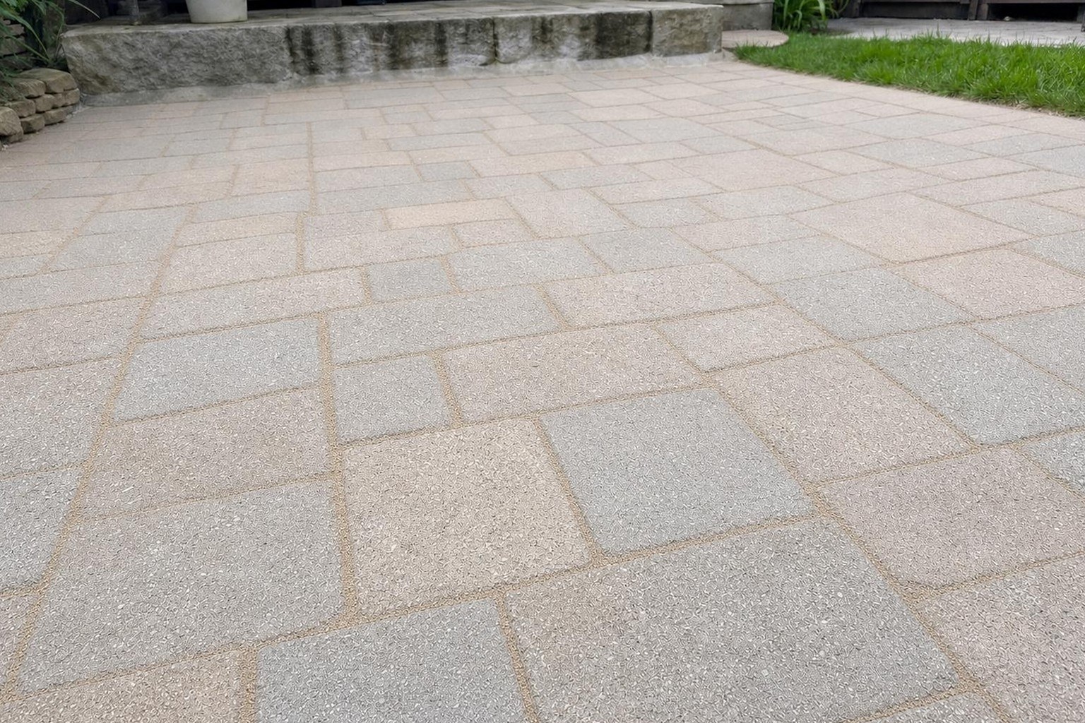 The same patio with every joint filled level with fresh polymeric sand