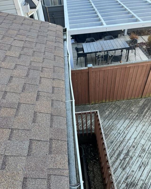 The same gutter after clearing, clean and clear