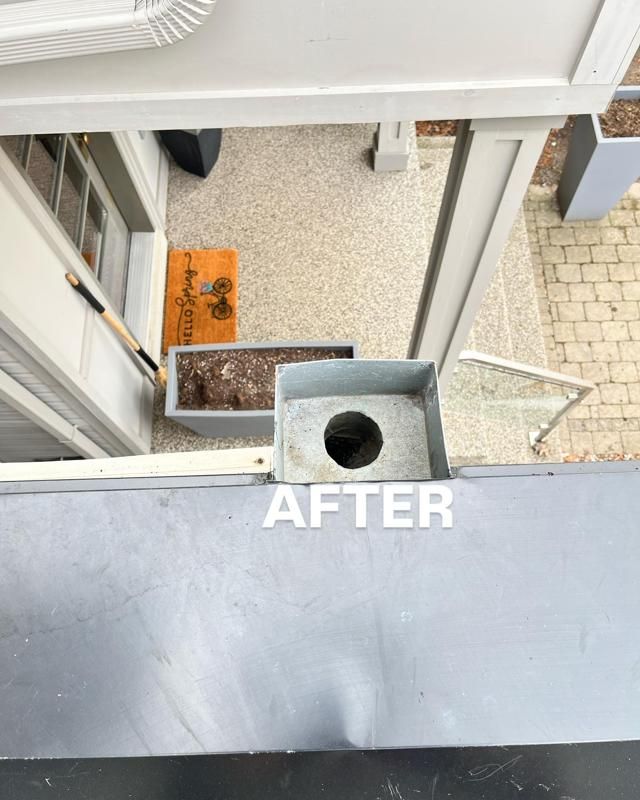 The same downspout after flushing, clear and open, marked After